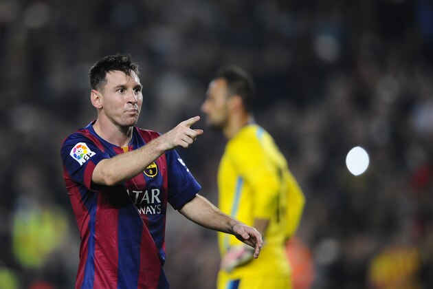 FC Barcelona's Lionel Messi, from Argentina, celebrates after scoring against Sevilla during a Spanish La Liga soccer match between FC Barcelona and Sevilla,  at the Camp Nou stadium in Barcelona, Spain, Saturday, Nov. 22, 2014. Messi, set a La Liga scoring record of 253 goals when he claimed a hat-trick in Saturday's match at the Camp Nou stadium against Sevilla. (AP Photo/Manu Fernandez)
