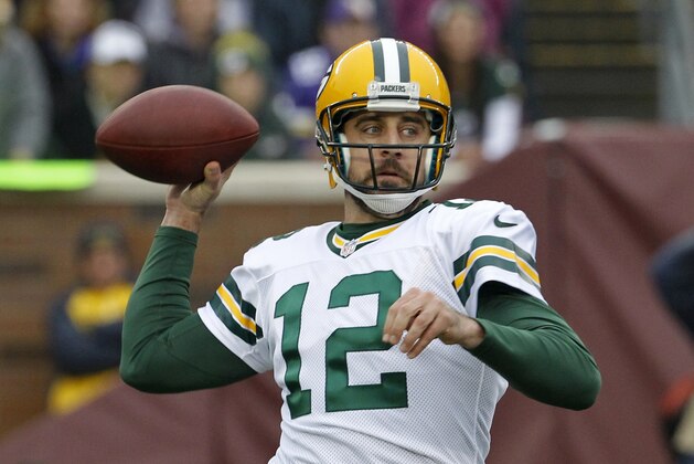 Green Bay Packers quarterback Aaron Rodgers throws a pass during the first half of an NFL football game against the Minnesota Vikings, Sunday, Nov. 23, 2014, in Minneapolis. (AP Photo/Ann Heisenfelt)