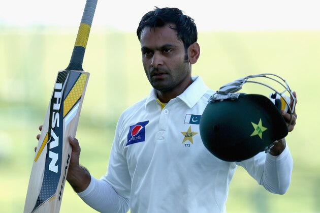 ABU DHABI, UNITED ARAB EMIRATES - NOVEMBER 12:  Mohammad Hafeez of Pakistan celebrates reaching his century during day four of the first test between Pakistan and New Zealand at Sheikh Zayed Stadium on November 12, 2014 in Abu Dhabi, United Arab Emirates.  (Photo by Warren Little/Getty Images)