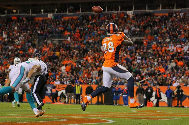 DENVER, CO - NOVEMBER 23:  Wide receiver Demaryius Thomas #88 of the Denver Broncos leaps to catch a 5-yard pass mid-stride in the end zone for a third quarter touchdown, his third of the night, against the Miami Dolphins during a game at Sports Authority Field at Mile High on November 23, 2014 in Denver, Colorado.  (Photo by Justin Edmonds/Getty Images)