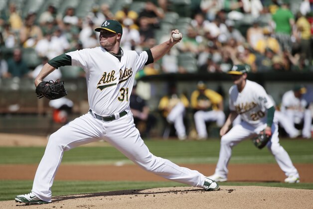 Oakland Athletics starting pitcher Jon Lester throws to the Los Angeles Angels during the first inning of a baseball game on Wednesday, Sept. 24, 2014, in Oakland, Calif. (AP Photo/Marcio Jose Sanchez)