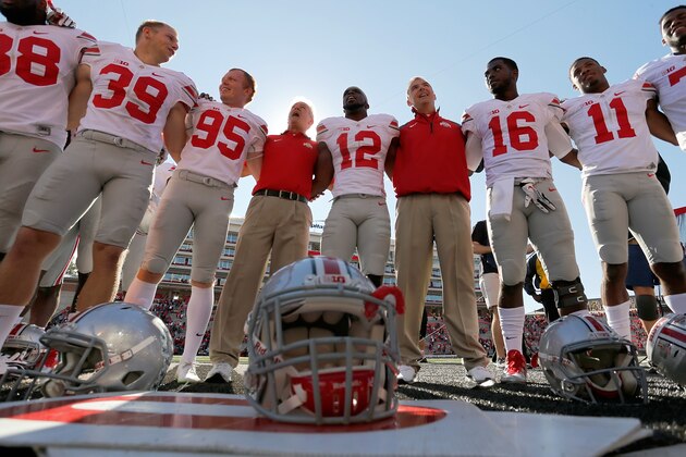 COLLEGE PARK, MD - OCTOBER 04:  Head coach Urban Meyer (4th R) of the Ohio State Buckeyes sings the school song Carmen Ohio with his team after their 52-24 win over the Maryland Terrapins at Byrd Stadium on October 4, 2014 in College Park, Maryland. Also pictured are players Kyle Clinton #39, Cameron Johnston #95, Cardale Jones #12, J.T. Barrett #16 and Vonn Bell #11.  (Photo by Jonathan Ernst/Getty Images)