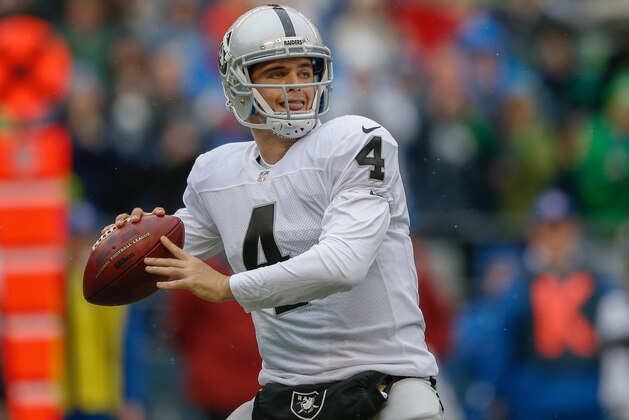 SEATTLE, WA - NOVEMBER 02:  Quarterback Derek Carr #4 of the Oakland Raiders passes against the Seattle Seahawks at CenturyLink Field on November 2, 2014 in Seattle, Washington.  (Photo by Otto Greule Jr/Getty Images)