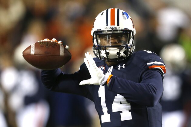 Auburn quarterback Nick Marshall (14) warms up before an NCAA college football game against Samford on Saturday, Nov. 22, 2014, in Auburn, Ala. (AP Photo/Butch Dill)