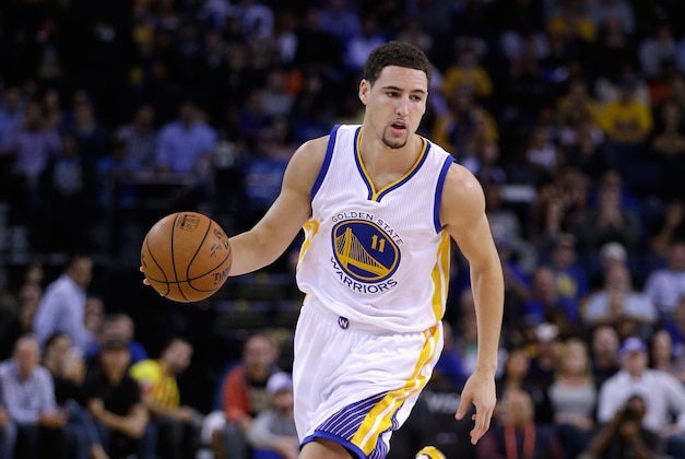 OAKLAND, CA - NOVEMBER 11:  Klay Thompson #11 of the Golden State Warriors in action against the San Antonio Spurs at ORACLE Arena on November 11, 2014 in Oakland, California. NOTE TO USER: User expressly acknowledges and agrees that, by downloading and or using this photograph, User is consenting to the terms and conditions of the Getty Images License Agreement.  (Photo by Ezra Shaw/Getty Images)