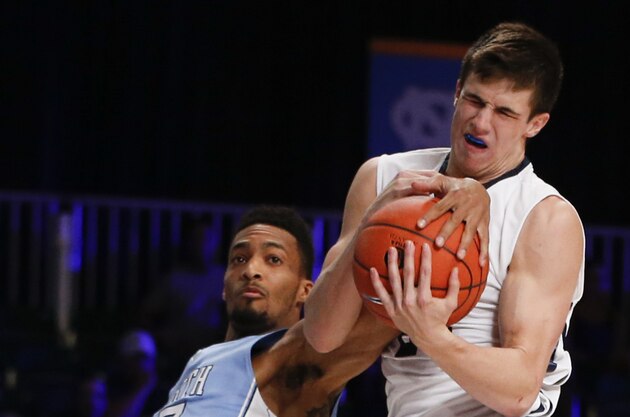 Nov 26, 2014; Paradise Island, BAHAMAS; Butler Bulldogs guard Kellen Dunham (24) battles for a loose ball with North Carolina Tar Heels forward J.P. Tokoto (13) during the first half at Atlantis Resort Imperial Arena. Mandatory Credit: Kevin Jairaj-USA TODAY Sports