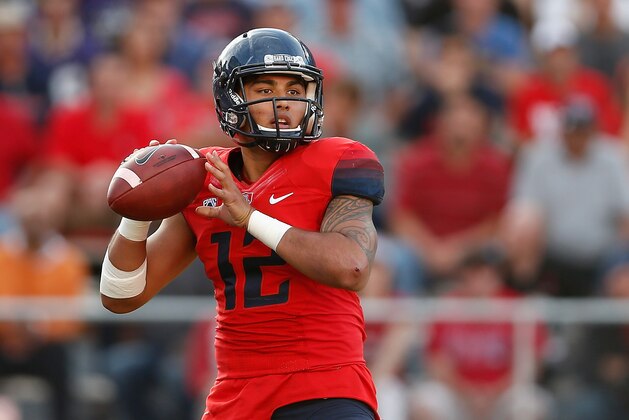 TUCSON, AZ - NOVEMBER 15:  Quarterback Anu Solomon #12 of the Arizona Wildcats drops back to pass during the college football game against the Washington Huskies at Arizona Stadium on November 15, 2014 in Tucson, Arizona. The Wildcats defeated the Huskies 27-26.  (Photo by Christian Petersen/Getty Images)