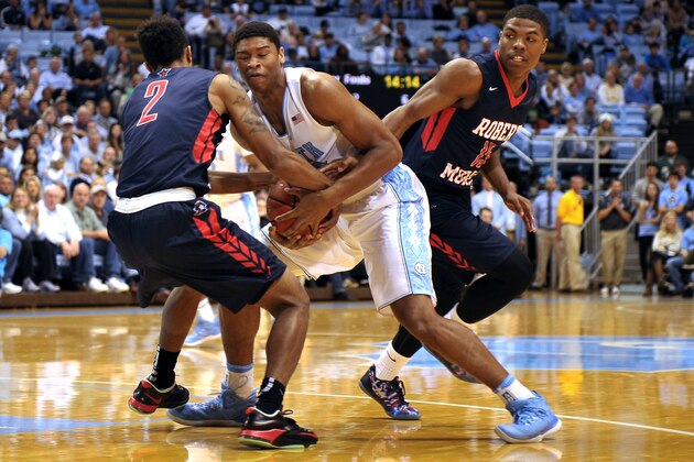 CHAPEL HILL, NC - NOVEMBER 16: Isaiah Hicks #22 of the North Carolina Tar Heels fights for the ball against Marcquise Reed #2 and Jafar Kinsey #15 of the Robert Morris Colonials during their game at the Dean Smith Center on November 16, 2014 in Chapel Hill, North Carolina. (Photo by Lance King/Getty Images)