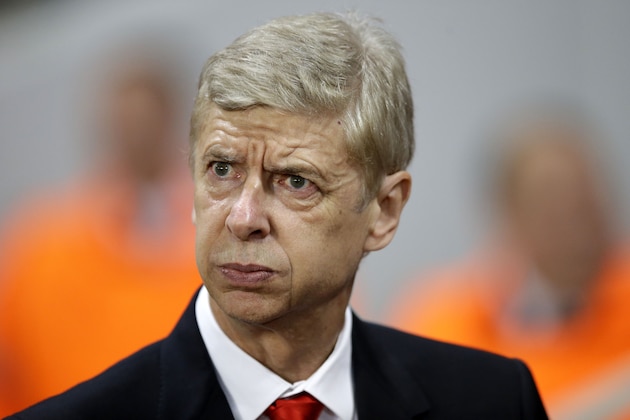 Arsenal's head coach Arsene Wenger enters the pitch prior to a Champions League, Group D soccer match between Arsenal and Anderlecht, at the Emirates Stadium, in London, Tuesday, Nov. 4, 2014. (AP Photo/Matt Dunham)