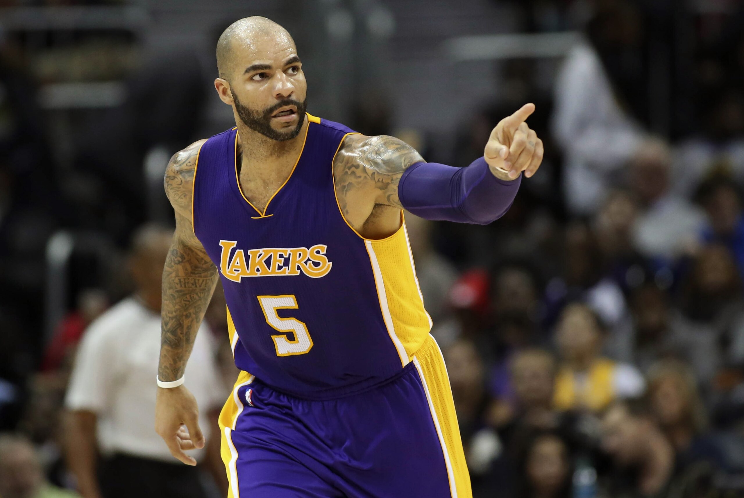 Nov 18, 2014; Atlanta, GA, USA; Los Angeles Lakers forward Carlos Boozer (5) reacts after making a basket in the third quarter of their game against the Atlanta Hawks at Philips Arena. The Lakers won 114-109. Mandatory Credit: Jason Getz-USA TODAY Sports