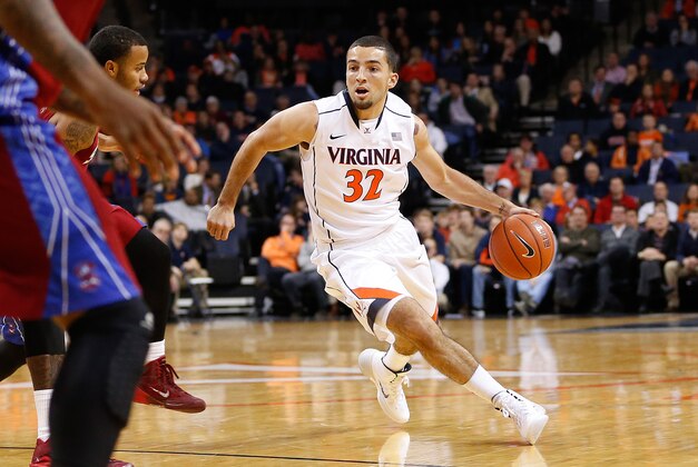 Nov 18, 2014; Charlottesville, VA, USA; Virginia Cavaliers guard London Perrantes (32) dribbles the ball against the South Carolina State Bulldogs at John Paul Jones Arena. Mandatory Credit: Amber Searls-USA TODAY Sports