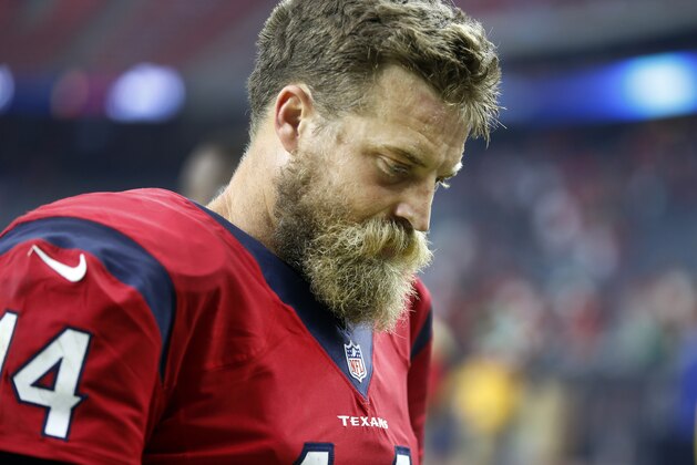 Houston Texans quarterback Ryan Fitzpatrick walks off the field following the Texans' 31-21 loss to the Philadelphia Eagles in an NFL football game, Sunday, Nov. 2, 2014, in Houston. (AP Photo/Patric Schneider)