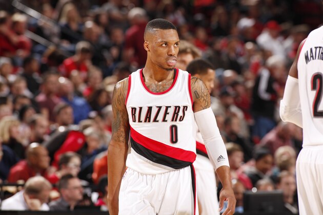 PORTLAND, OR - NOVEMBER 17: Damian Lillard #0 of the Portland Trail Blazers during the game on November 17, 2014 at the Moda Center Arena in Portland, Oregon. NOTE TO USER: User expressly acknowledges and agrees that, by downloading and or using this photograph, user is consenting to the terms and conditions of the Getty Images License Agreement. Mandatory Copyright Notice: Copyright 2014 NBAE (Photo by Cameron Browne/NBAE via Getty Images)