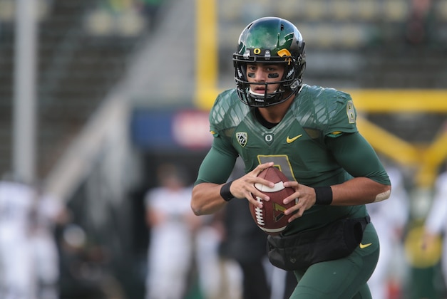 Nov 22, 2014; Eugene, OR, USA; Oregon Ducks quarterback Marcus Mariota (8) readies to throw the ball before the game against the Colorado Buffaloes at Autzen Stadium. Mandatory Credit: Scott Olmos-USA TODAY Sports