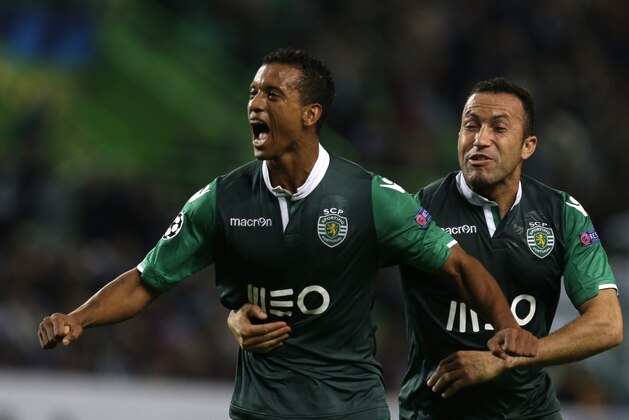 Sporting's Nani, left, celebrates with Jefferson Nascimento  after scoring during a Champions League Group G soccer match between Sporting and Maribor at Sporting's Alvalade stadium, in Lisbon, Tuesday, Nov. 25, 2014. (AP Photo/Francisco Seco)