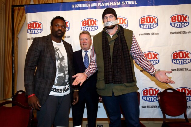 LONDON, ENGLAND - SEPTEMBER 22:  Dereck Chisora and Tyson Fury go head-to-head during the Dereck Chisora And Tyson Fury Press Conference at The Grosvenor House on September 22, 2014 in London, England.  (Photo by Jordan Mansfield/Getty Images)