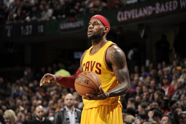 CLEVELAND, OH -  NOVEMBER 26: LeBron James #23 of the Cleveland Cavaliers looks to pass the ball against the Washington Wizards during the game on November 26, 2014 at Quicken Loans Arena in Cleveland, Ohio. NOTE TO USER: User expressly acknowledges and agrees that, by downloading and or using this Photograph, user is consenting to the terms and conditions of the Getty Images License Agreement. Mandatory Copyright Notice: Copyright 2014 NBAE (Photo by David Kyle/NBAE via Getty Images)