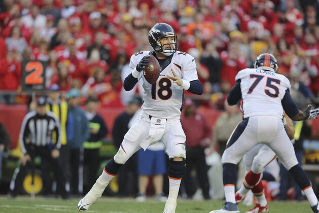 Denver Broncos quarterback Peyton Manning (18) works against the Kansas City Chiefs during the first half of an NFL football game, Sunday, Dec. 1, 2013, in Kansas City, Mo. (AP Photo/Ed Zurga)
