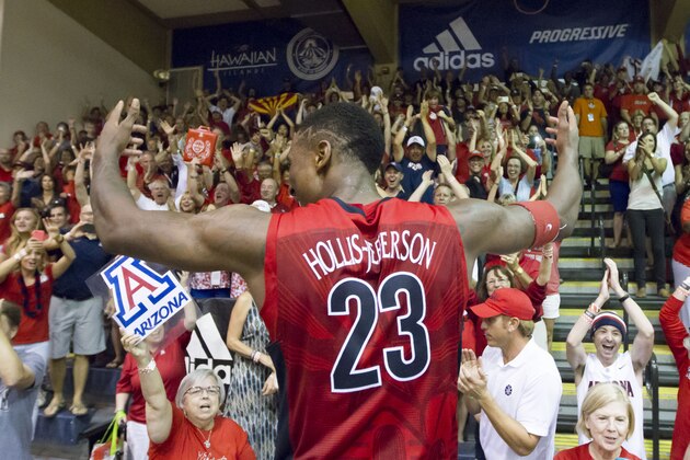 Arizona forward Rondae Hollis-Jefferson celebrates with Arizona fans after the team defeated San Diego State 61-59 in an NCAA college basketball game to win the Maui Invitational on Wednesday, Nov. 26, 2014, in Lahaina, Hawaii. (AP Photo/Eugene Tanner)