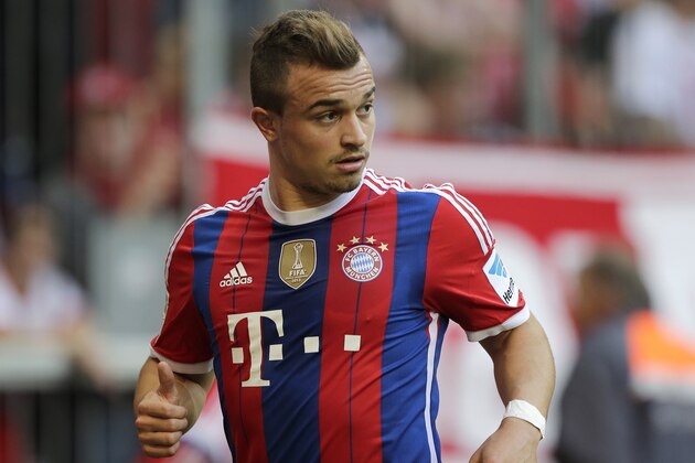 Bayern's Xherdan Shaqiri of Switzerland watches his team mates during the German first division Bundesliga soccer match between FC Bayern and SV Werder Bremen in the Allianz Arena in Munich, Germany, on Saturday, Oct. 18, 2014. (AP Photo/Matthias Schrader)