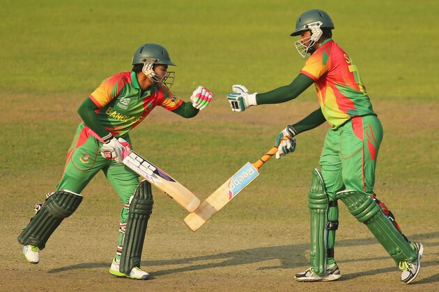 DHAKA, BANGLADESH - APRIL 01:  Mushfiqur Rahim congratulates Shakib Al Hasan of Bangladesh as he reaches his fifty during the ICC World Twenty20 Bangladesh 2014 match between Bangladesh and Australia at Sher-e-Bangla Mirpur Stadium on April 1, 2014 in Dhaka, Bangladesh.  (Photo by Scott Barbour/Getty Images)