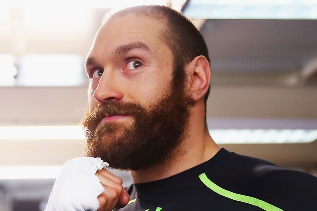 LONDON, ENGLAND - NOVEMBER 26:  Tyson Fury in action during a Media Work Out session at the Peacock Gym in Canning Town on November 26, 2014 in London, England. Tyson Fury will fight Dereck Chisora at ExCeL London on the 29th November.  (Photo by Bryn Lennon/Getty Images)