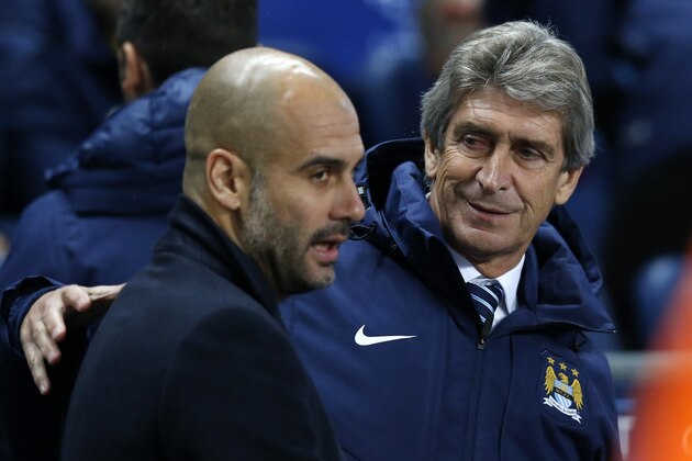 Manchester City's head coach Manuel Pellegrini, right, speaks with Bayern's head coach Pep Guardiola before the Champions League group E soccer match between Manchester City and Bayern Munich, at the Etihad Stadium, in Manchester, England, Tuesday, Nov. 25, 2014. Manchester City won 3-2. (AP Photo/Jon Super)
