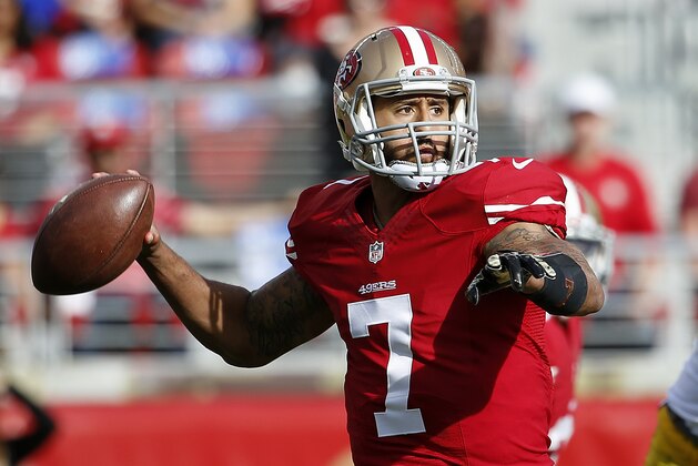 San Francisco 49ers quarterback Colin Kaepernick (7) passes against the Washington Redskins during the first quarter of an NFL football game in Santa Clara, Calif., Sunday, Nov. 23, 2014. (AP Photo/Tony Avelar)