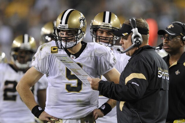 New Orleans Saints head coach Sean Payton talks to quarterback Drew Brees during the second half of an NFL football game against the Green Bay Packers Thursday, Sept. 8, 2011, in Green Bay, Wis. The Packers won 42-34. (AP Photo/Jim Prisching)