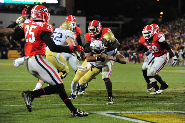 ATLANTA, GA - NOVEMBER 30: Vad Lee #2 of the Georgia Tech Yellow Jackets carries the ball for a first overtime touchdown against Amarlo Herrera #52 of the Georgia Bulldogs at Bobby Dodd Stadium on November 30, 2013 in Atlanta, Georgia. (Photo by Scott Cunningham/Getty Images)