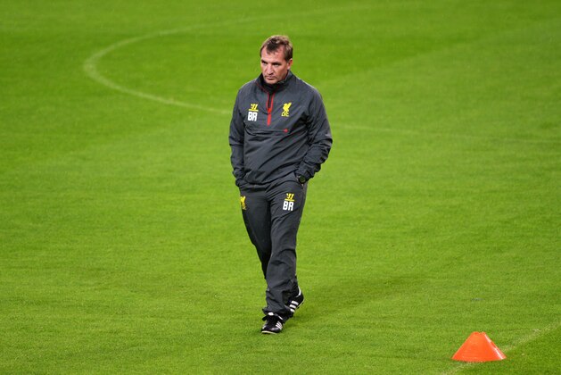 Liverpool's coach Brendan Rodgers walks along the field during a training session in Madrid, Spain, Monday Nov. 3, 2014. Liverpool will play Real Madrid on Tuesday in a Group B Champions League soccer match. (AP Photo)
