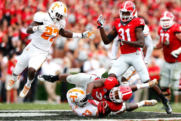 ATHENS, GA - SEPTEMBER 27:  LaDarrell McNeil #33 of the Tennessee Volunteers tackles Todd Gurley #3 of the Georgia Bulldogs at Sanford Stadium on September 27, 2014 in Athens, Georgia.  (Photo by Kevin C. Cox/Getty Images)