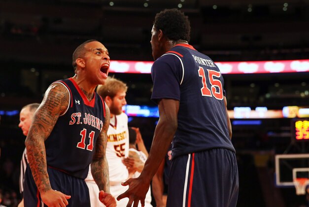 Nov 26, 2014; New York, NY, USA; St. John's Red Storm guard D'Angelo Harrison (11) reacts to a basket during the second half against the Minnesota Golden Gophers at Madison Square Garden. St. John's Red Storm won 70-61. Mandatory Credit: Anthony Gruppuso-USA TODAY Sports