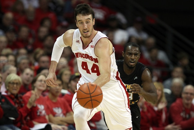 Nov 14, 2014; Madison, WI, USA; Wisconsin Badgers forward Frank Kaminsky (44) drives the ball up the floor as Northern Kentucky Norse guard Todd Johnson (right) follows at the Kohl Center. Wisconsin defeated Northern Kentucky 62-31. Mandatory Credit: Mary Langenfeld-USA TODAY Sports