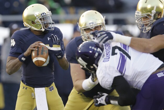 Notre Dame quarterback Everett Golson (5)  looks to a pass against Northwestern during the first half of an NCAA college football game in South Bend, Ind., Saturday, Nov. 15, 2014. (AP Photo/Nam Y. Huh)