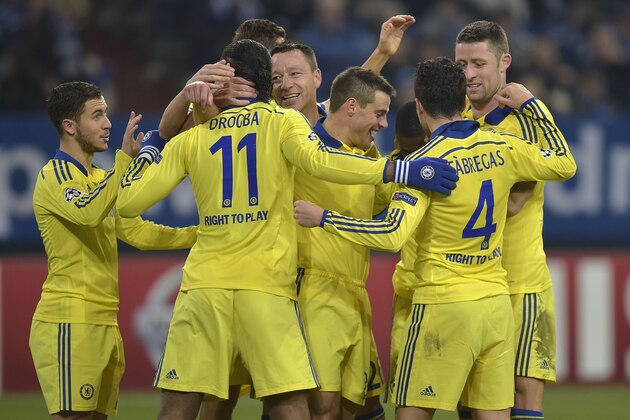 Chelsea's team celebrates their 5th goal during the Champions League group G soccer match between FC Schalke 04 and Chelsea in Gelsenkirchen, Germany, Tuesday, Nov. 25, 2014. Schalke was defeated by Chelsea with 0-5. (AP Photo/Martin Meissner)