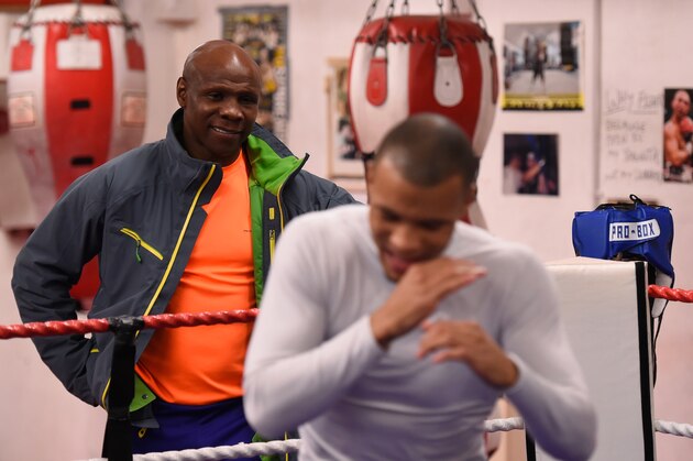 BRIGHTON, ENGLAND - NOVEMBER 14:  Proud father and manager Chris Eubank watches as his son Chris Eubank Jnr shadow boxes during a training session at the Brighton and Hove Boxing Club on November 14, 2014 in Brighton, England.  (Photo by Mike Hewitt/Getty Images)