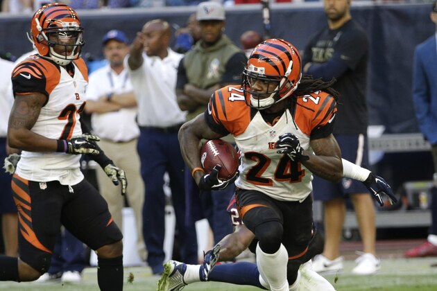 Cincinnati Bengals cornerback Adam Jones (24) returns a kick against the Houston Texans during the fourth quarter of an NFL football game, Sunday, Nov. 23, 2014, in Houston. (AP Photo/David J. Phillip)