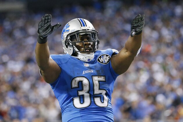 Detroit Lions running back Joique Bell points to the crowd after his 1-yard touchdown run during the first half of an NFL football game against the Chicago Bears in Detroit, Thursday, Nov. 27, 2014. (AP Photo/Rick Osentoski)