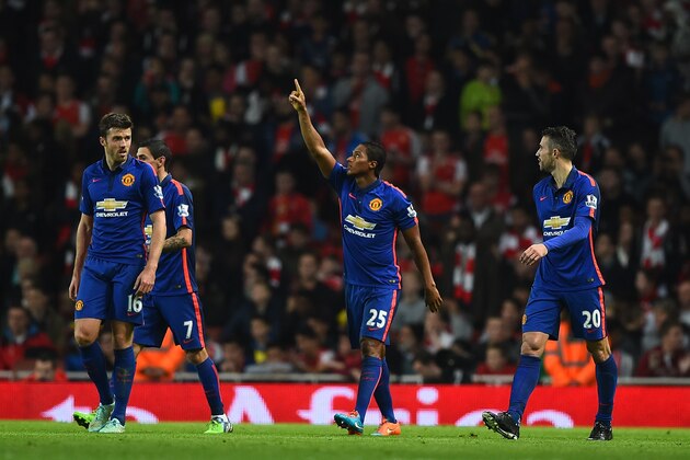 LONDON, ENGLAND - NOVEMBER 22:  Antonio Valencia (C) of Manchester United celebrates after Kieran Gibbs of Arsenal scored an own-goal during the Barclays Premier League match between Arsenal and Manchester United at Emirates Stadium on November 22, 2014 in London, England. (Photo by Shaun Botterill/Getty Images)