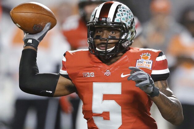 FILE -  In this Jan. 3, 2014 file photo, Ohio State quarterback Braxton Miller passes the football during the first half of the Orange Bowl NCAA college football game against Clemson, Friday, Jan. 3, 2014, in Miami Gardens, Fla. Ohio State ended the season with a two game losing streak. (AP Photo/Wilfredo Lee, File)