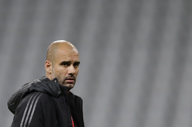 Bayern's head coach Pep Guardiola of Spain attends a training session prior to the Champions League Group E soccer match between FC Bayern Munich and AS Roma at Allianz Arena in Munich, southern Germany, Tuesday Nov. 4, 2014. Bayern Munich will face Roma on Wednesday. (AP Photo/Matthias Schrader)