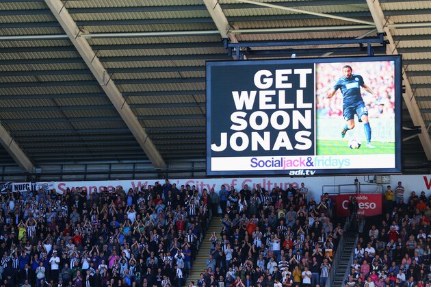 SWANSEA, WALES - OCTOBER 04:  The scoreboard displays a message of support for Jonas Gutierrez of Newcastle United during the Barclays Premier League match between Swansea City and Newcastle United at Liberty Stadium on October 4, 2014 in Swansea, Wales.  (Photo by Michael Steele/Getty Images)