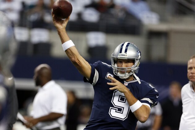 Dallas Cowboys quarterback Tony Romo (9) passes as he warms up before an NFL football game against the Philadelphia Eagles, Thursday, Nov. 27, 2014, in Arlington, Texas. (AP Photo/John F. Rhodes)