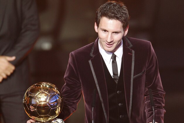 Argentina's Lionel Messi is awarded the prize for the soccer player of the year 2011 at the FIFA Ballon d'Or awarding ceremony in Zurich, Switzerland, Monday, Jan. 9, 2012. (AP Photo/Michael Probst)