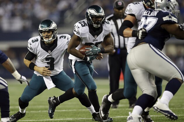 Philadelphia Eagles quarterback Mark Sanchez (3) hands the ball to running back LeSean McCoy (25) during the second half of an NFL football game, Thursday, Nov. 27, 2014, in Arlington, Texas. (AP Photo/Tim Sharp)