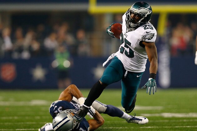 ARLINGTON, TX - NOVEMBER 27:  LeSean McCoy #25 of the Philadelphia Eagles runs over C.J. Spillman #37 of the Dallas Cowboys on his way to a touchdown in the second half at AT&T Stadium on November 27, 2014 in Arlington, Texas.  (Photo by Tom Pennington/Getty Images)