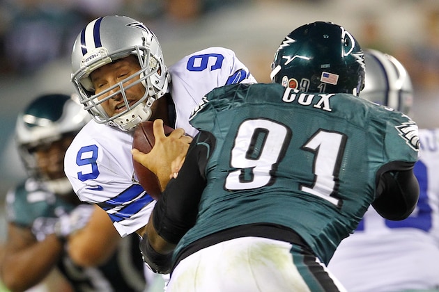 PHILADELPHIA, PA - NOVEMBER 11: Quarterback Tony Romo #9 of the Dallas Cowboys is grabbed by Fletcher Cox #91 of the Philadelphia Eagles but escapes to complete a pass during the third quarter in a game at Lincoln Financial Field on November 11, 2012 in Philadelphia, Pennsylvania. The Cowboys defeated the Eagles 38-23. (Photo by Rich Schultz /Getty Images)