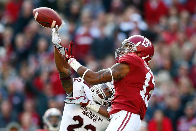 TUSCALOOSA, AL - NOVEMBER 15:  Matthew Wells #22 of the Mississippi State Bulldogs breaks up this reception intended for ArDarius Stewart #13 of the Alabama Crimson Tide at Bryant-Denny Stadium on November 15, 2014 in Tuscaloosa, Alabama.  (Photo by Kevin C. Cox/Getty Images)
