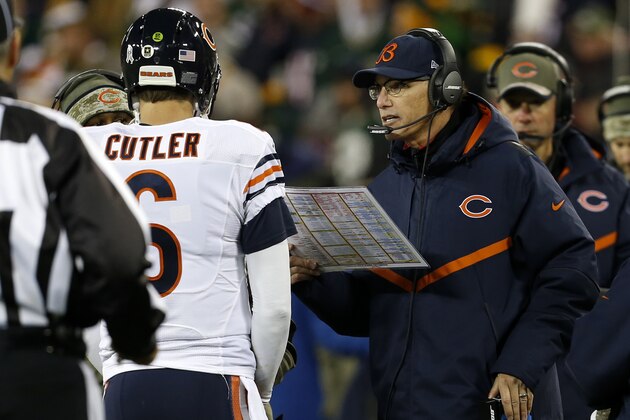 Chicago Bears head coach Marc Trestman talks to quarterback Jay Cutler (6) during the first half of an NFL football game against the Green Bay Packers Sunday, Nov. 9, 2014, in Green Bay, Wis. (AP Photo/Mike Roemer)